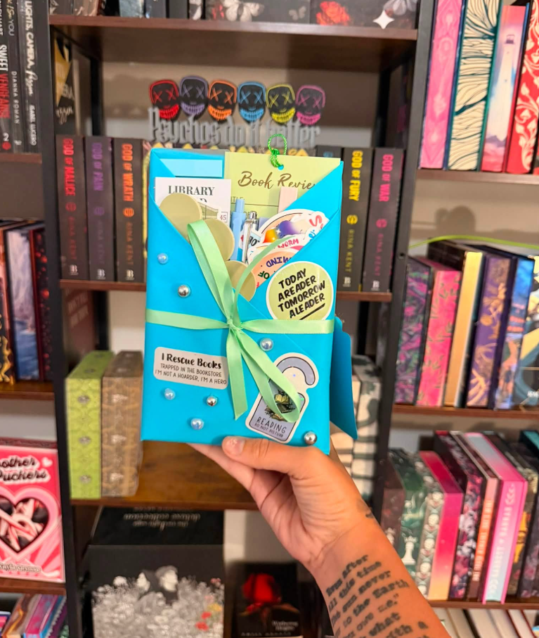 Blue-wrapped blind date book with green ribbon and Today a Reader stickers
