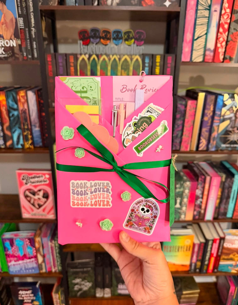 Hot pink-wrapped blind date book with green ribbon and Book Lover stickers